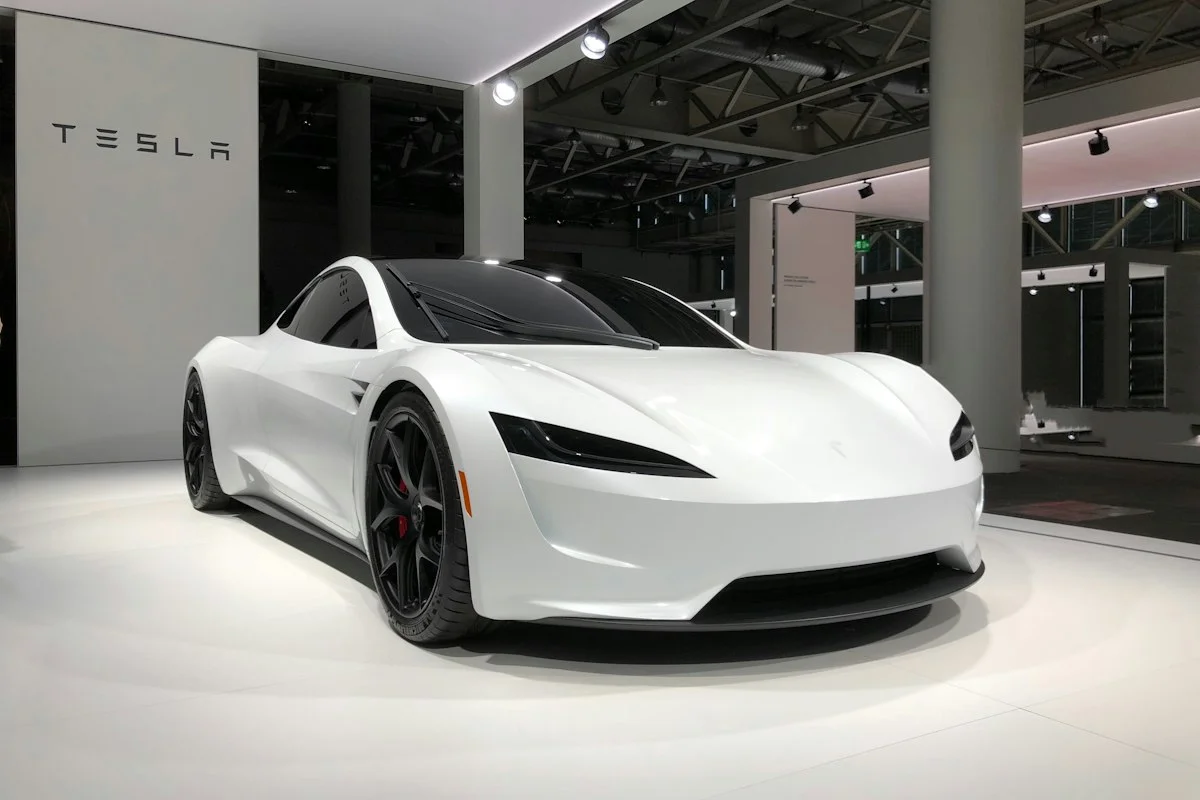 Electric vehicle connected to modern bidirectional V2H charging station in home garage
